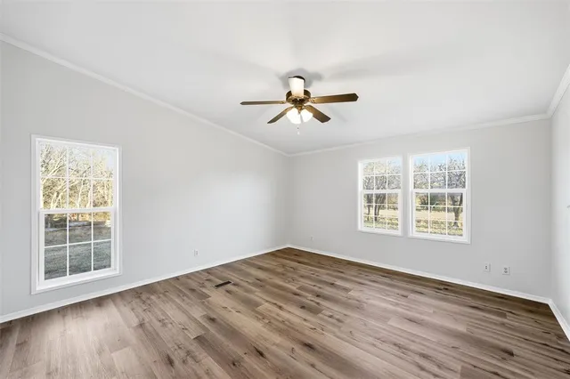 a spacious bathroom with a sink a shower a mirror and bathtub