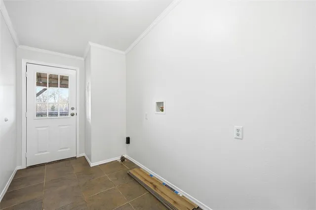 a view of a house with a small yard and wooden fence