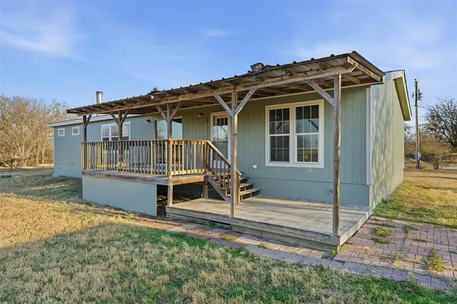a view of porch with wooden floor