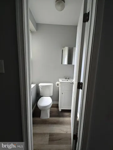 a bathroom with a toilet and a sink