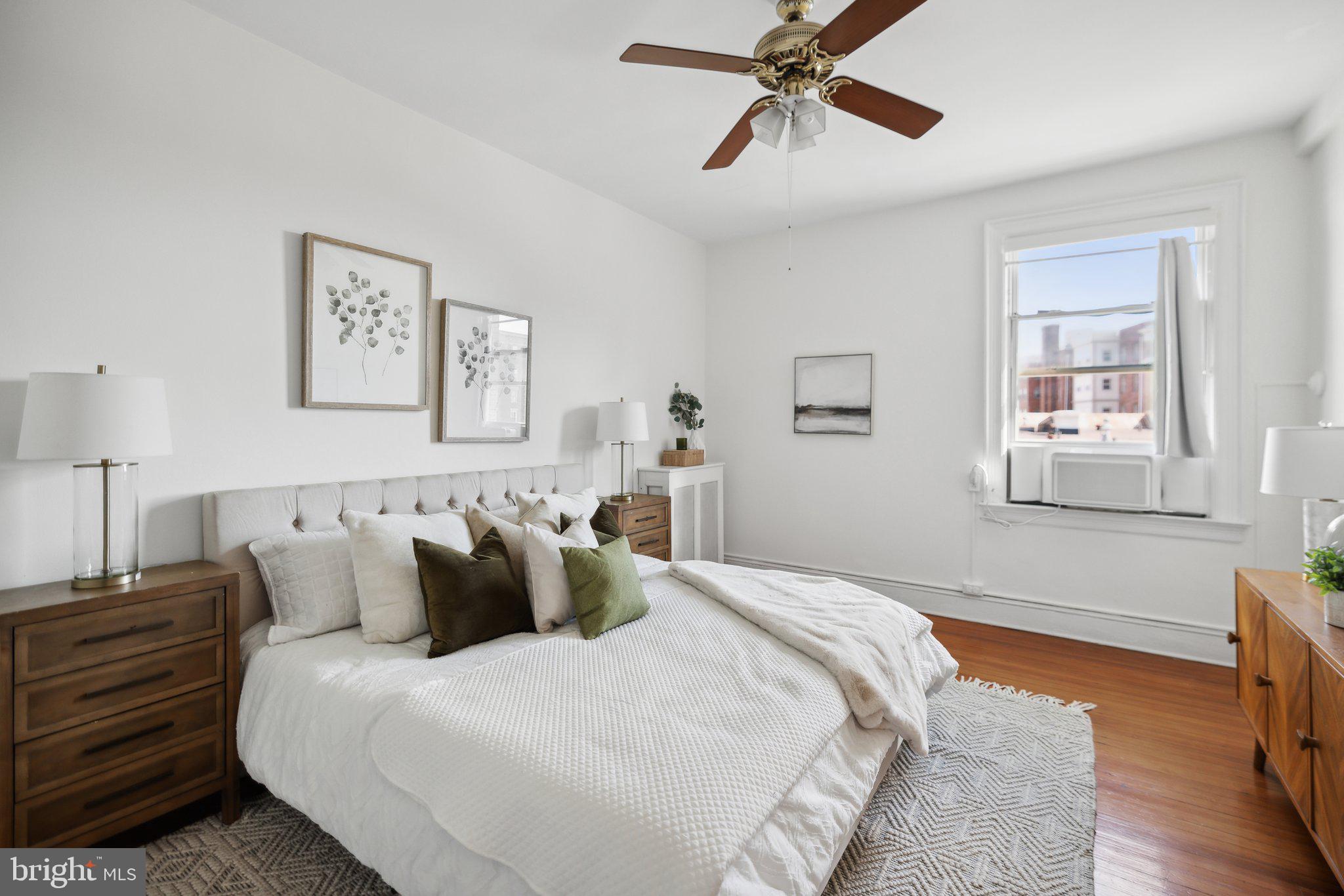 1852 Columbia Road Northwest, Unit 503 Washington, DC 20009 - Photo 23 of 32 a bedroom with bed and window
