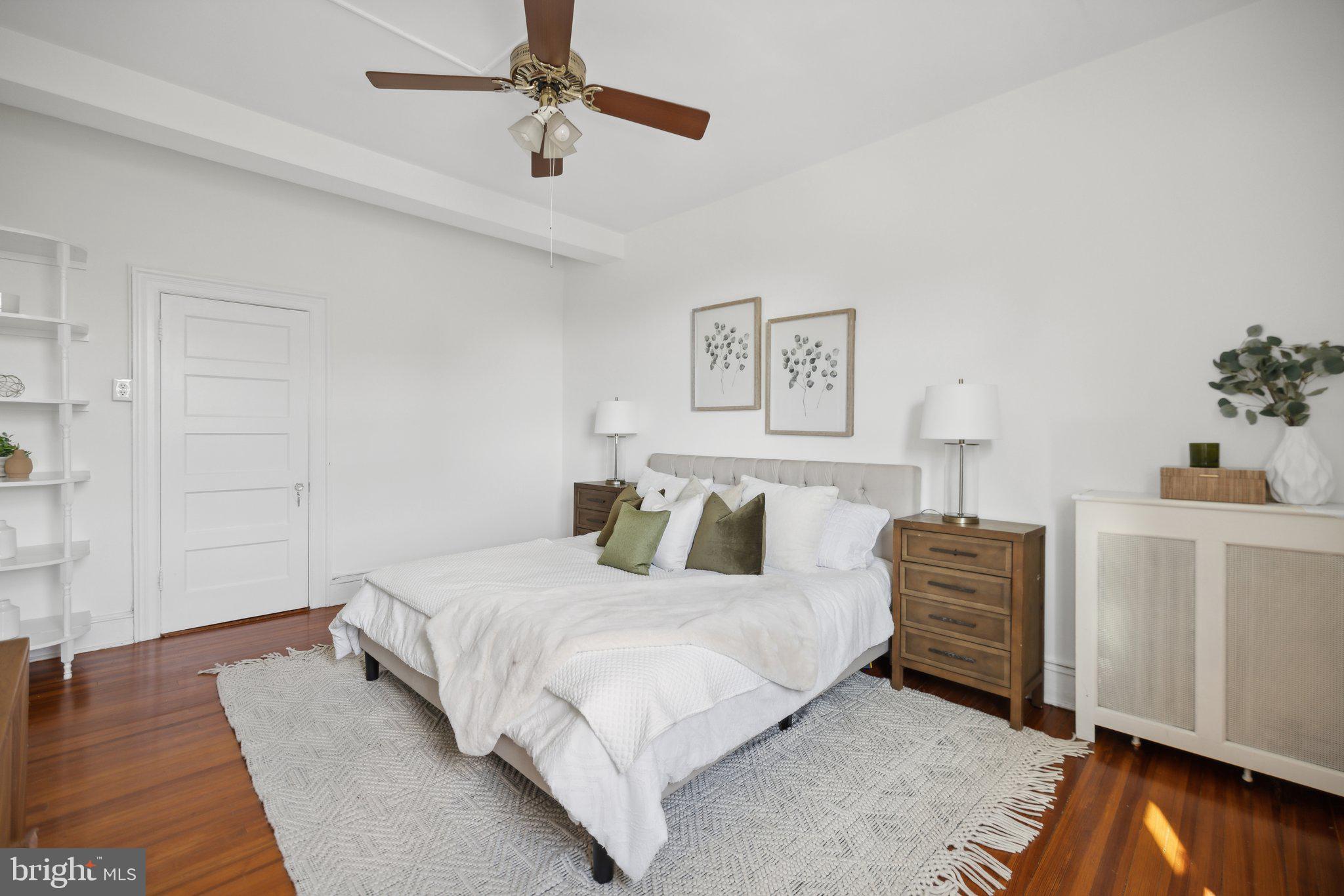 1852 Columbia Road Northwest, Unit 503 Washington, DC 20009 - Photo 25 of 32 a bedroom with a bed and a dresser