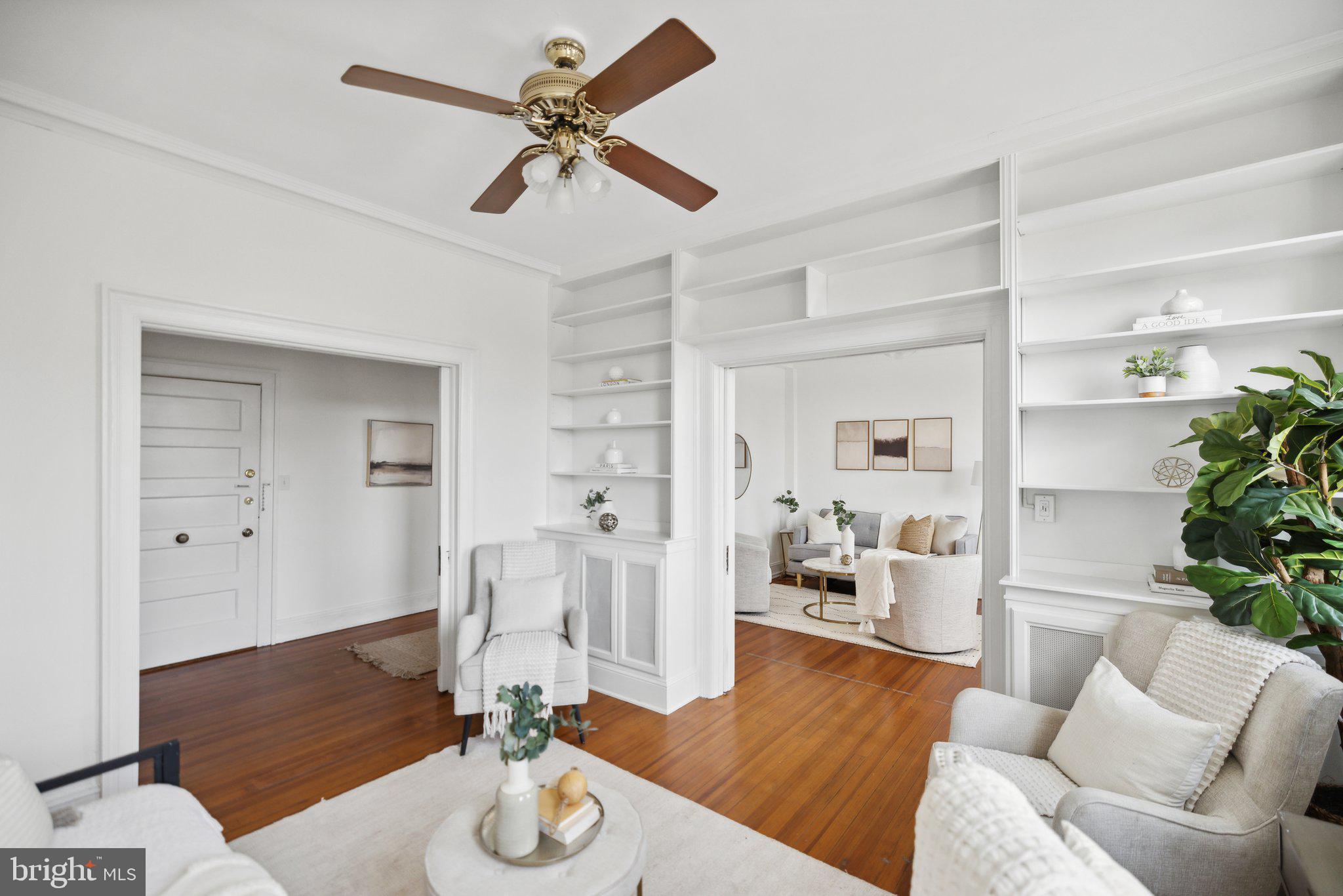 1852 Columbia Road Northwest, Unit 503 Washington, DC 20009 - Photo 6 of 32 a living room with furniture and wooden floor