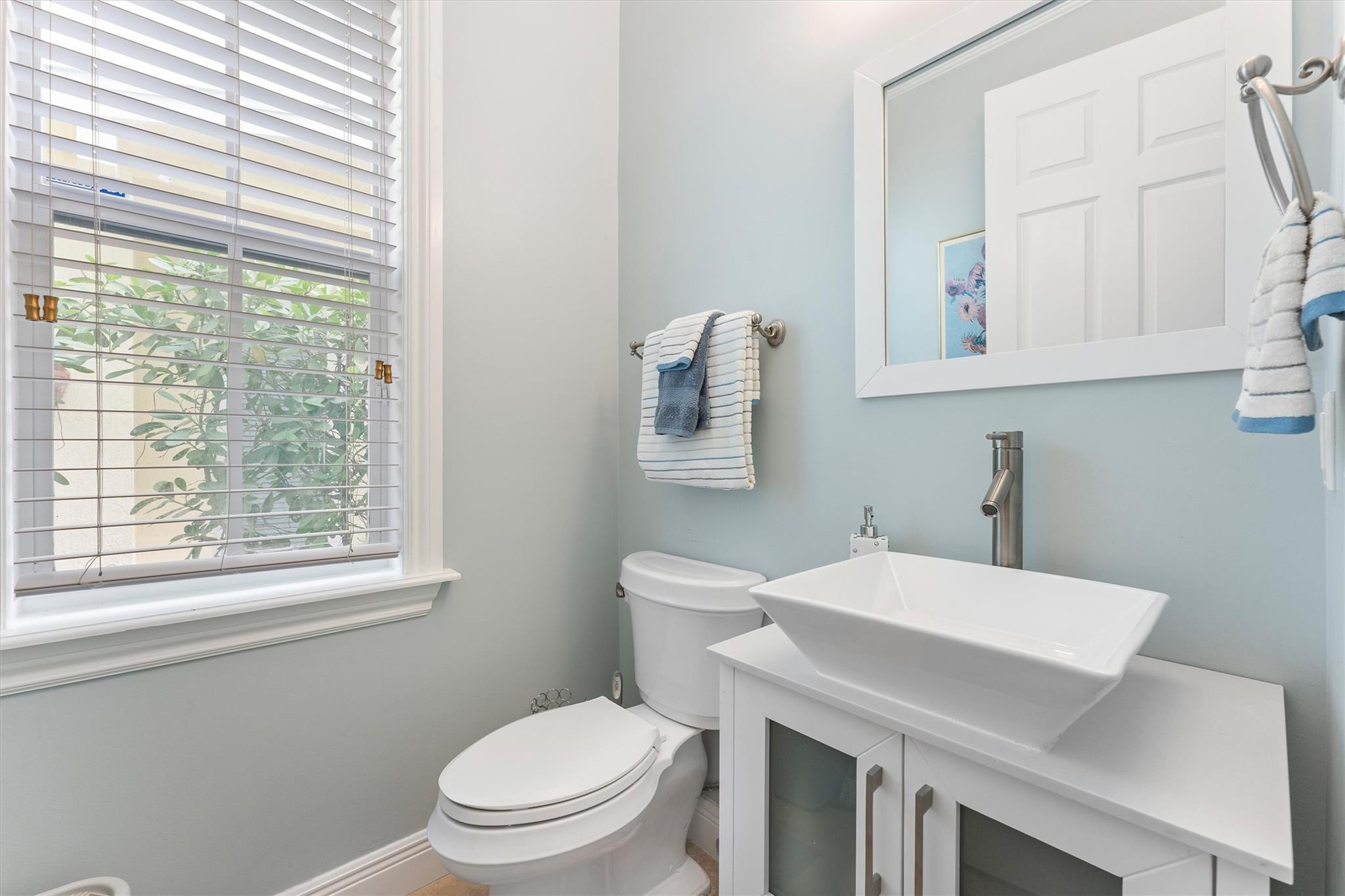950 Southwest 7th Street, Unit 950 Fort Lauderdale, FL 33315 - Photo 12 of 42 a bathroom with a sink a toilet and a window