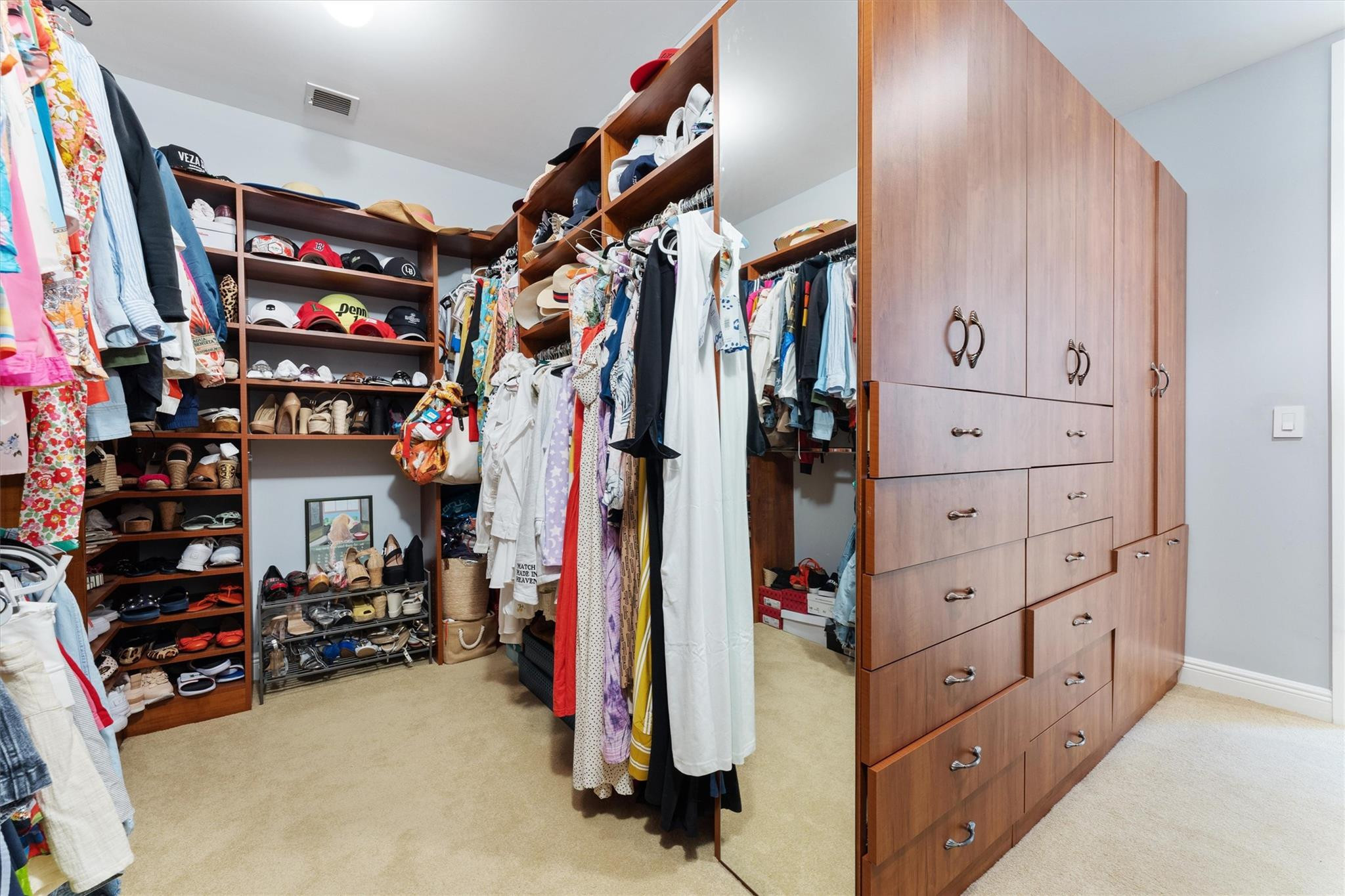 950 Southwest 7th Street, Unit 950 Fort Lauderdale, FL 33315 - Photo 23 of 42 a view of walk in closet with clothes and shoes
