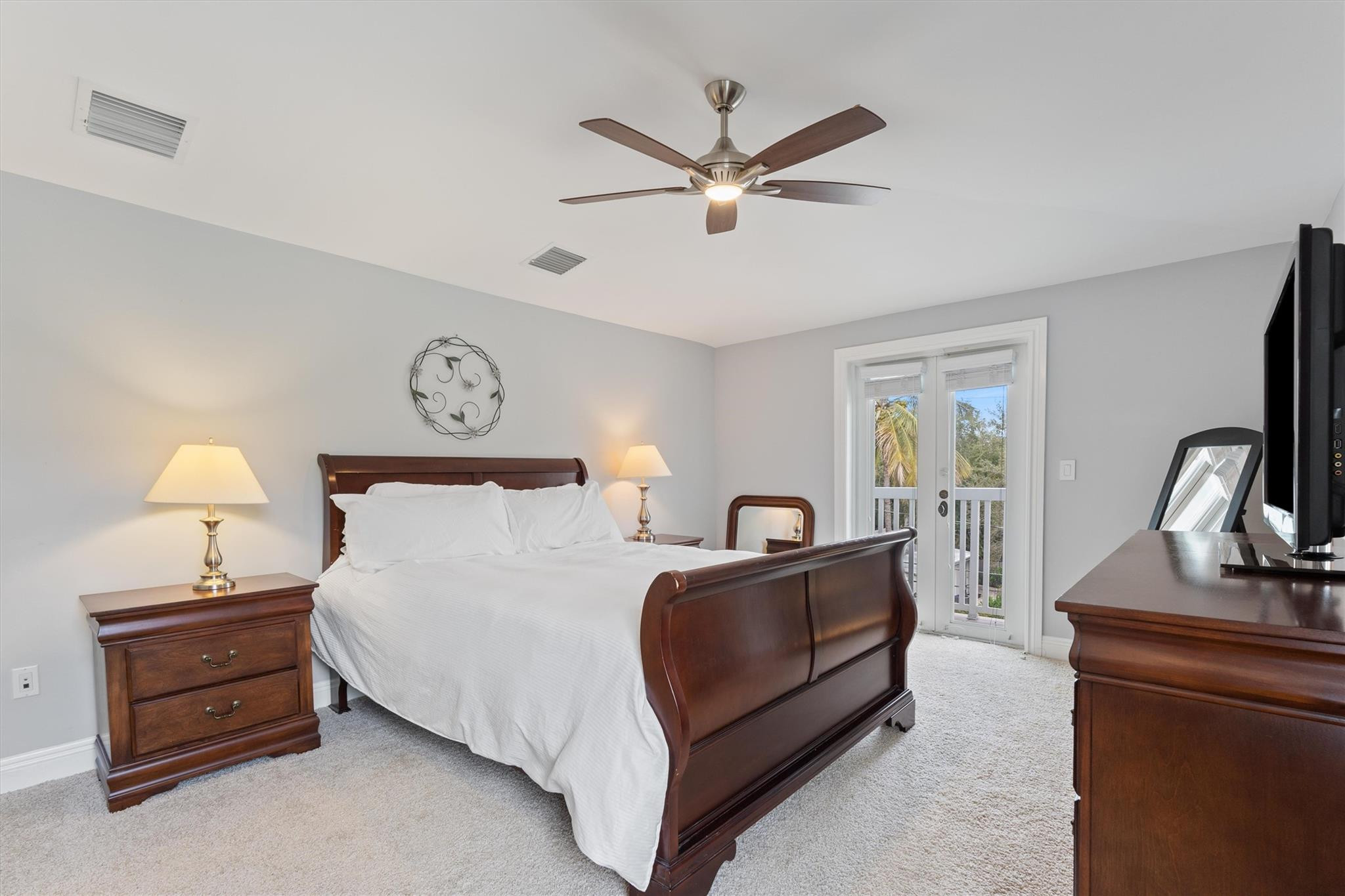 950 Southwest 7th Street, Unit 950 Fort Lauderdale, FL 33315 - Photo 25 of 42 a bedroom with a bed and a dresser with the shoe rack