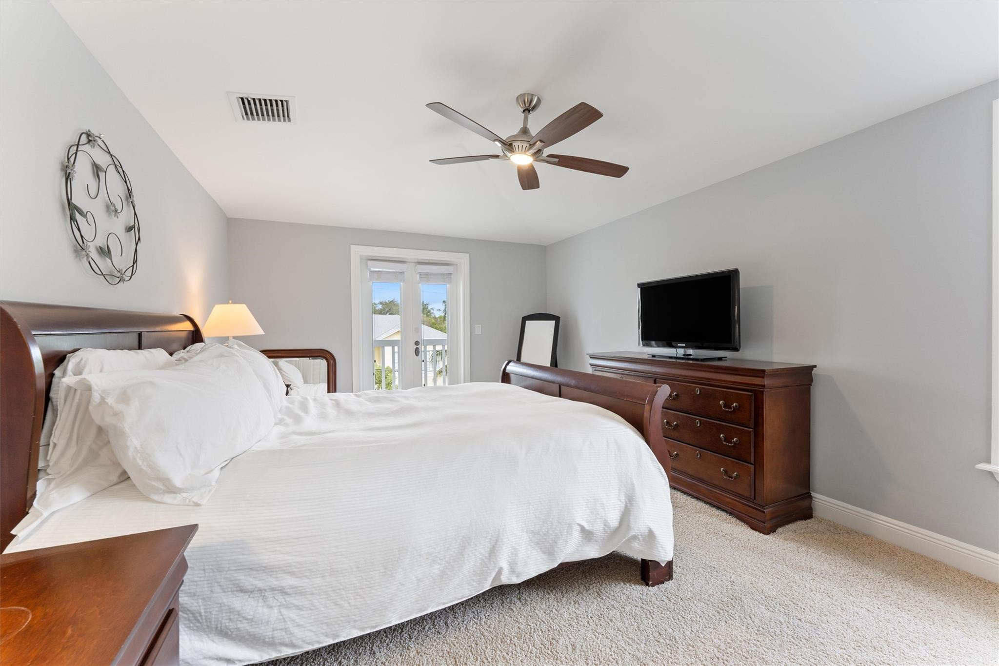 950 Southwest 7th Street, Unit 950 Fort Lauderdale, FL 33315 - Photo 26 of 42 a bedroom with a bed and a flat screen tv