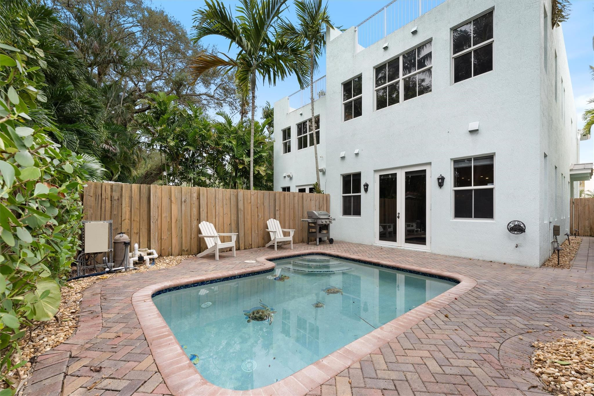 950 Southwest 7th Street, Unit 950 Fort Lauderdale, FL 33315 - Photo 36 of 42 a backyard of a house with barbeque oven and outdoor seating