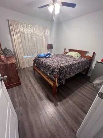 a bedroom with a bed and window