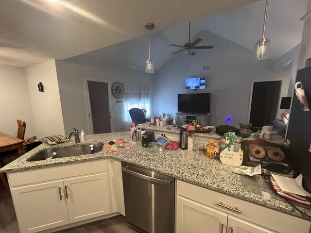 a kitchen with sink and a mirror