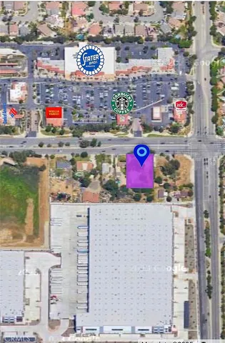 a view of a house with a yard and plants