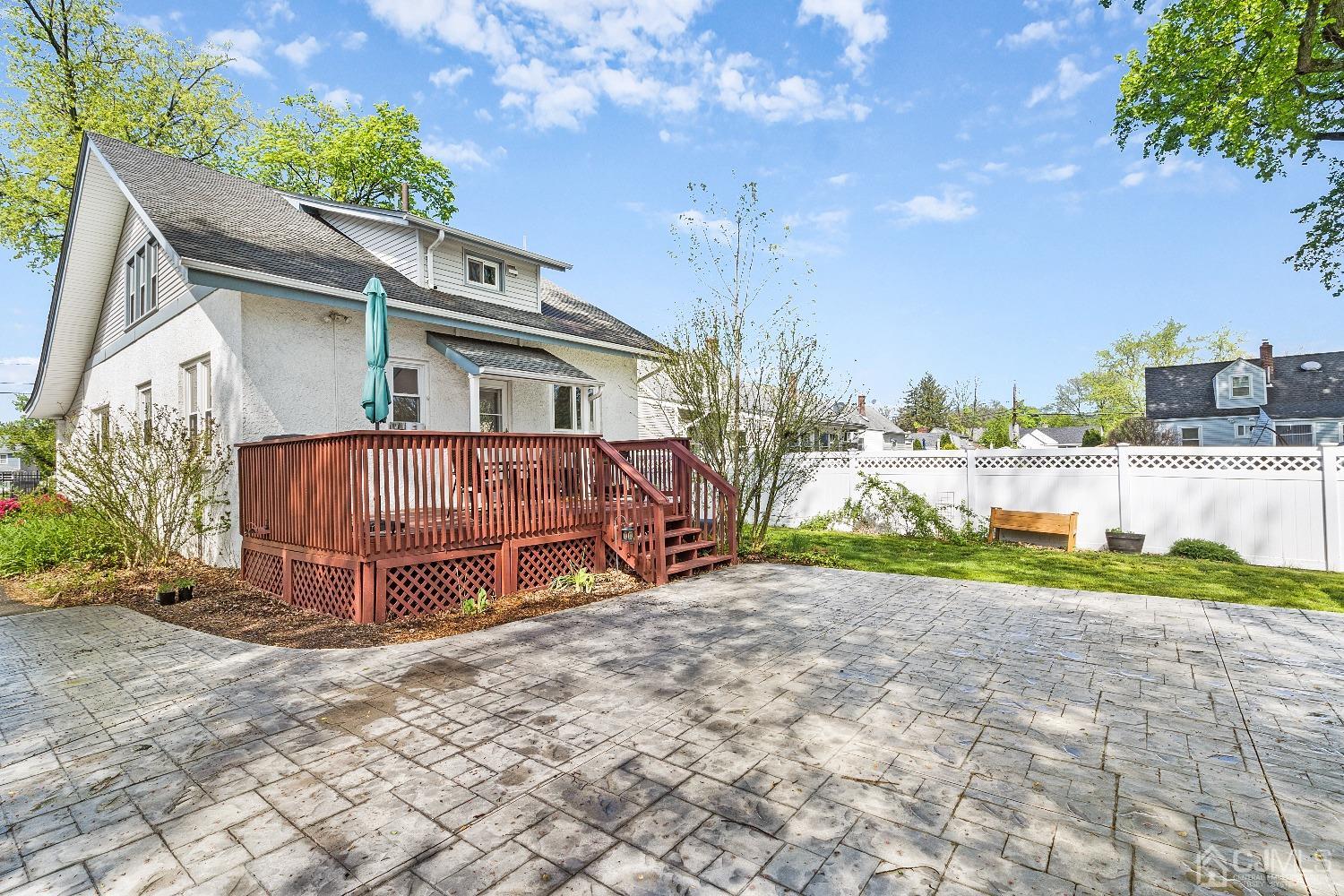 235 New Market Road Dunellen, NJ 08812 - Photo 23 of 25 a view of a house with a yard and sitting area