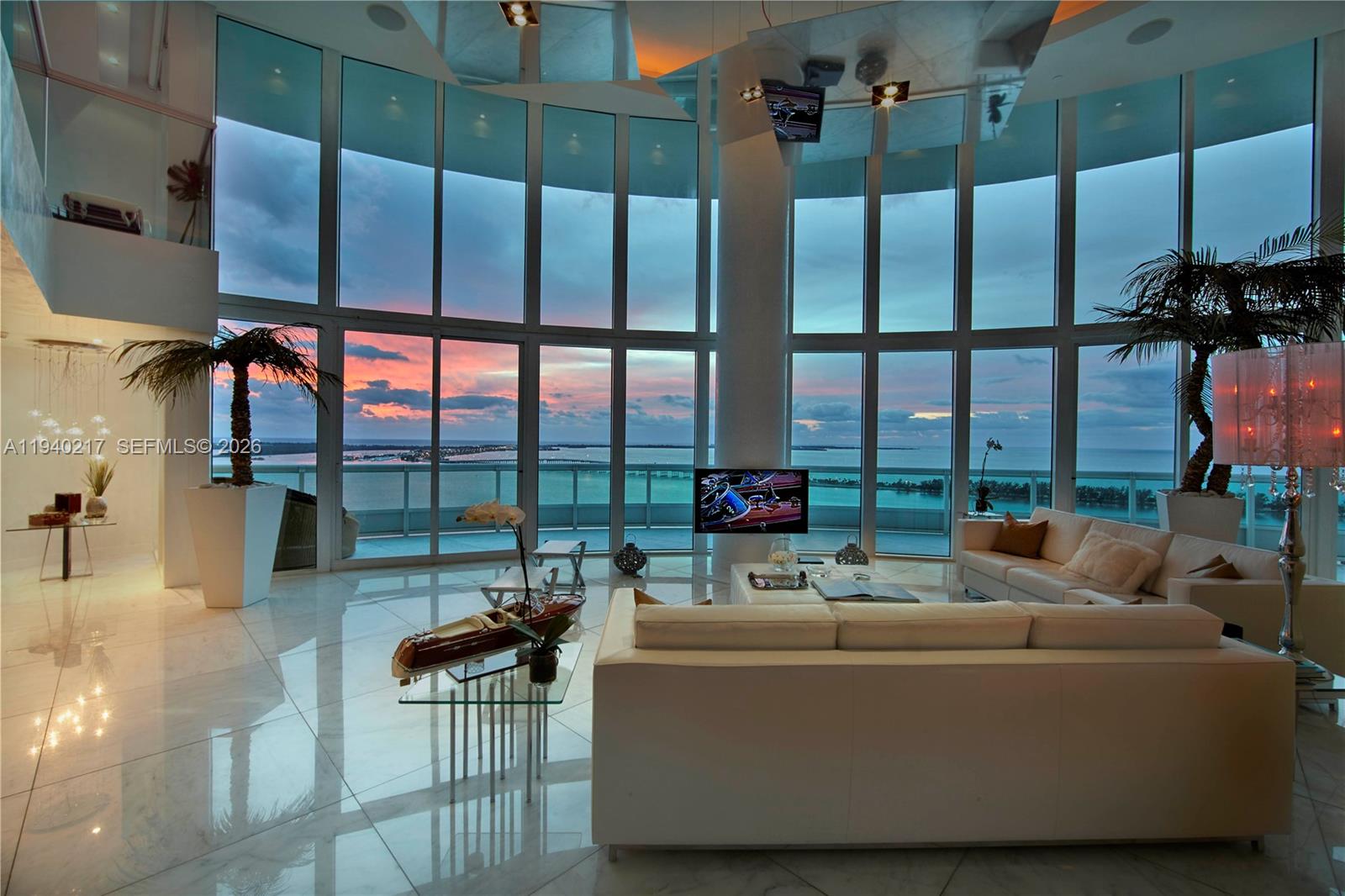 1643 Brickell Avenue, Unit 2902 Miami, FL 33129 - Photo 1 of 32 a living room with couch and a floor to ceiling window