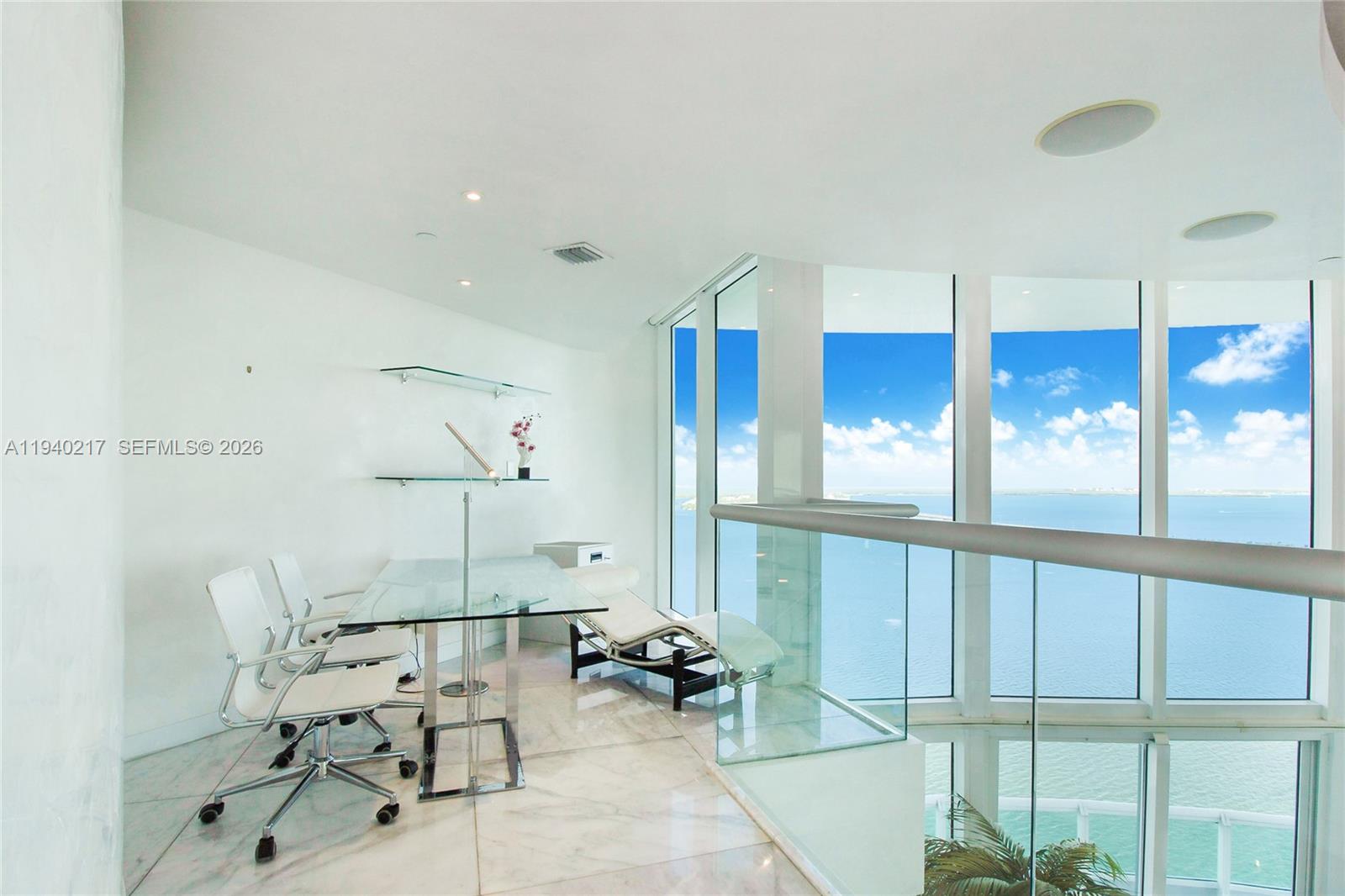 1643 Brickell Avenue, Unit 2902 Miami, FL 33129 - Photo 15 of 32 a very nice looking room with a large window and furniture