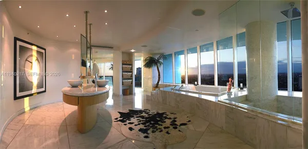 a bathroom with a tub and sink