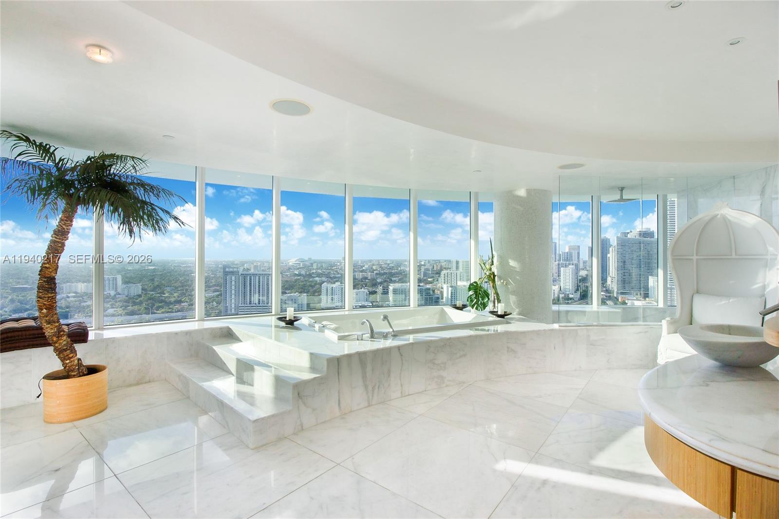 1643 Brickell Avenue, Unit 2902 Miami, FL 33129 - Photo 18 of 32 a bathroom with a tub and sink