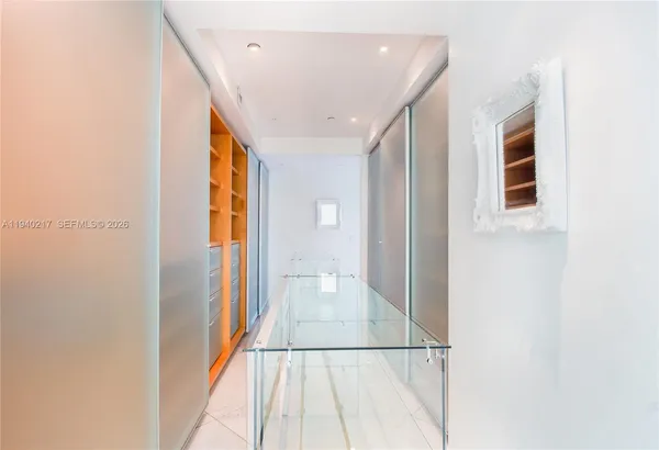 a bathroom with a toilet a sink and a large mirror