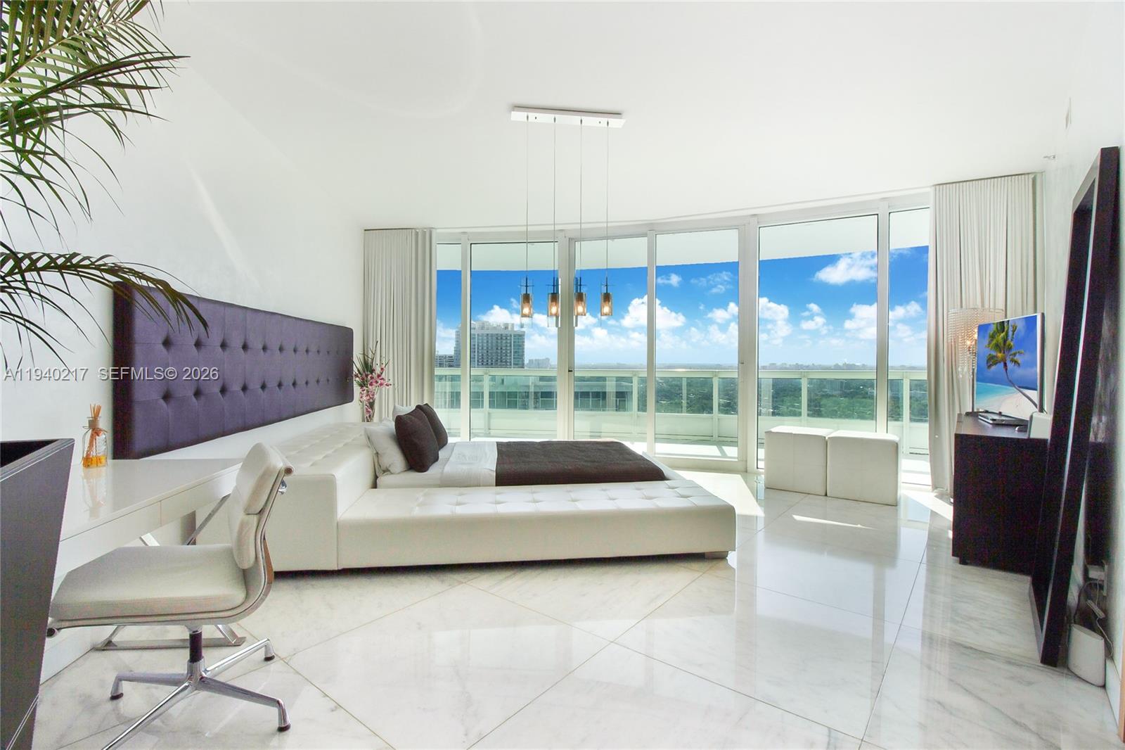 1643 Brickell Avenue, Unit 2902 Miami, FL 33129 - Photo 23 of 32 a living room with furniture and a large window