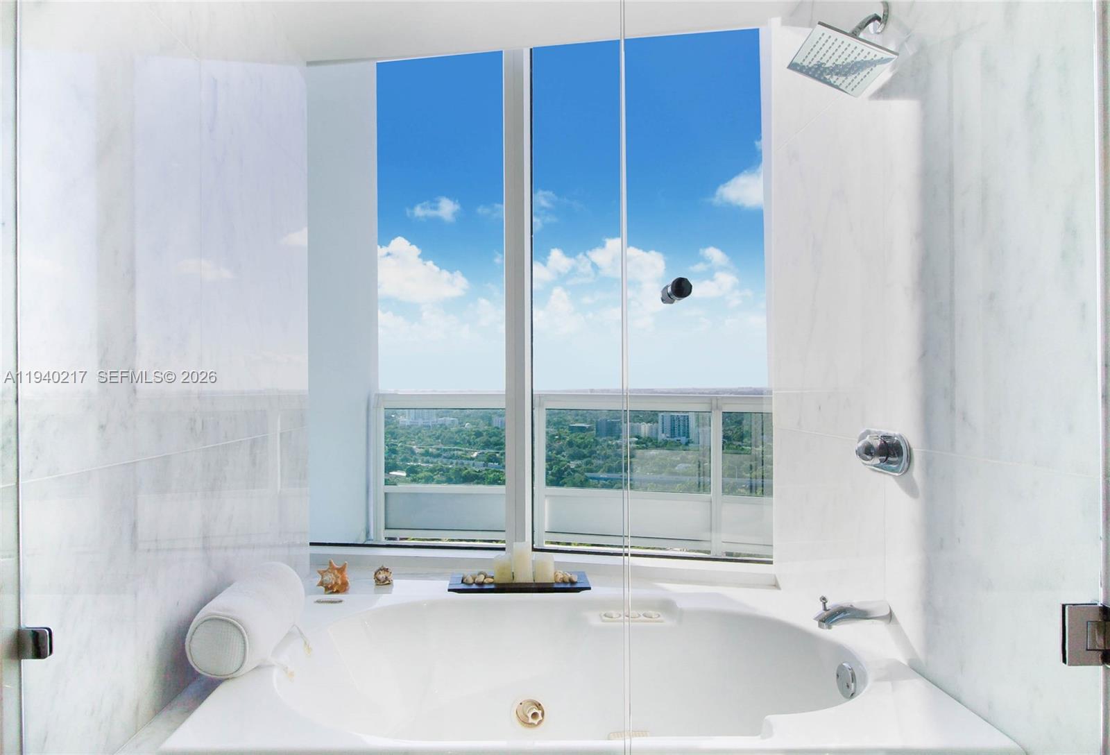 1643 Brickell Avenue, Unit 2902 Miami, FL 33129 - Photo 25 of 32 a bathroom with a tub and shower