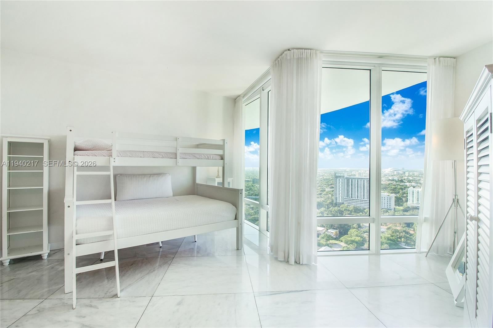 1643 Brickell Avenue, Unit 2902 Miami, FL 33129 - Photo 28 of 32 a view of a room with shelves and windows