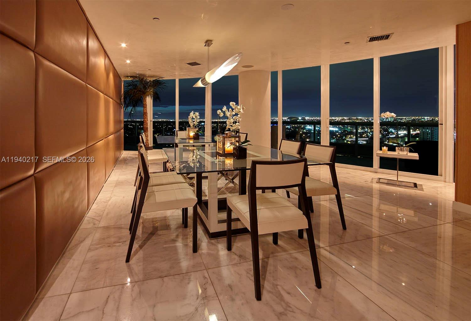 1643 Brickell Avenue, Unit 2902 Miami, FL 33129 - Photo 6 of 32 a view of a dining room with furniture