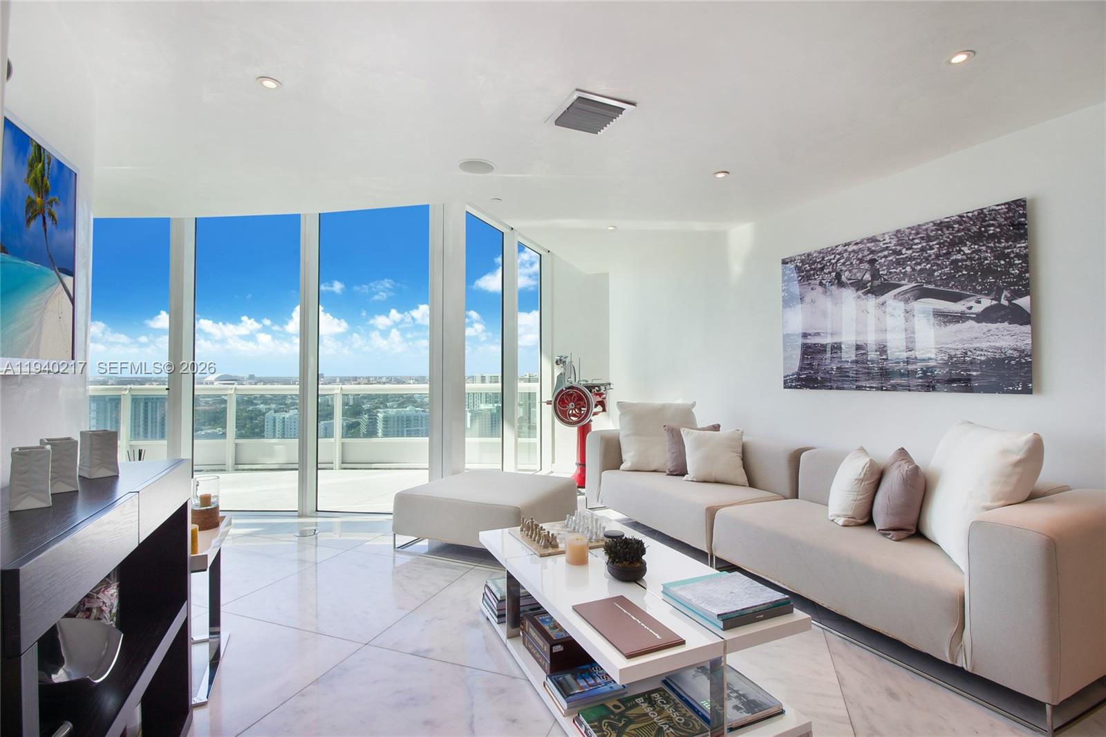 1643 Brickell Avenue, Unit 2902 Miami, FL 33129 - Photo 10 of 32 a living room with furniture and a large window