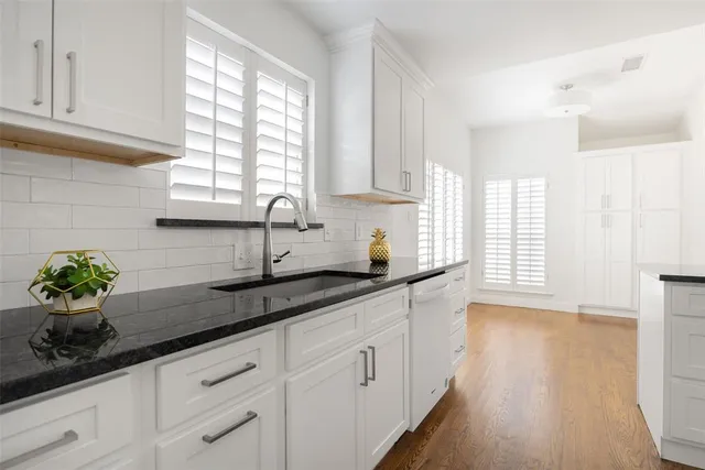 a kitchen with sink and window