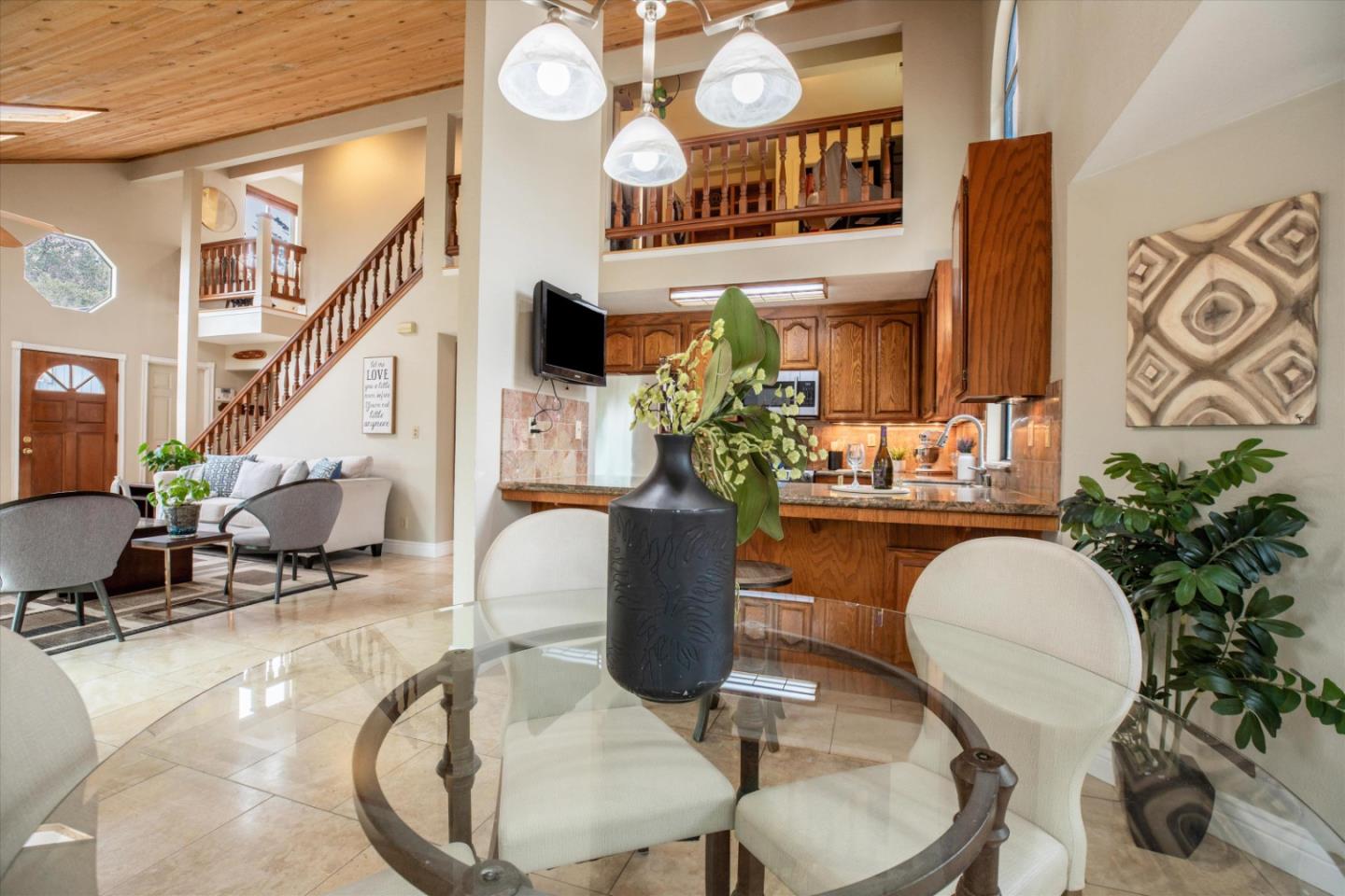 6333 Tustin Road Salinas, CA 93907 - Photo 16 of 88 a view of a dining room with furniture wooden floor and a chandelier
