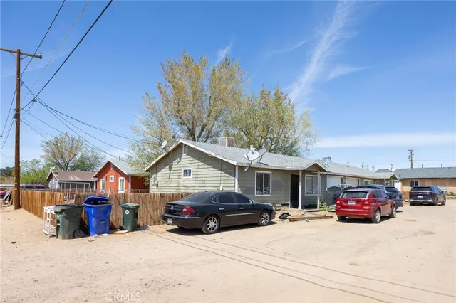 a view of a car park in front of house