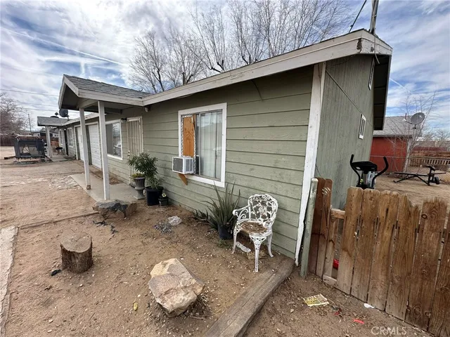 a front view of a house with seating space
