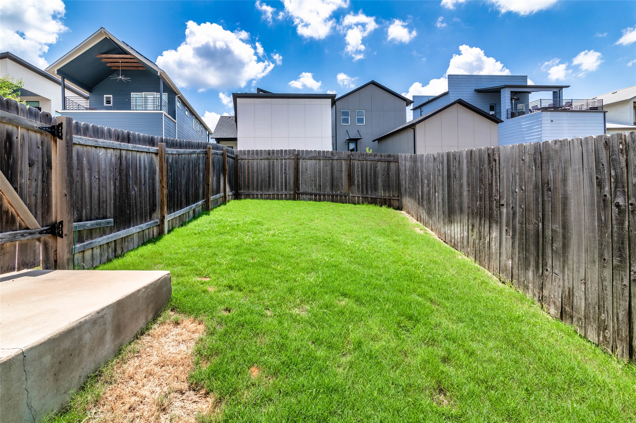 6025 Seville Drive Austin, TX 78724 - Photo 33 of 40 Private backyard space featuring a level lawn and perimeter wood fencing