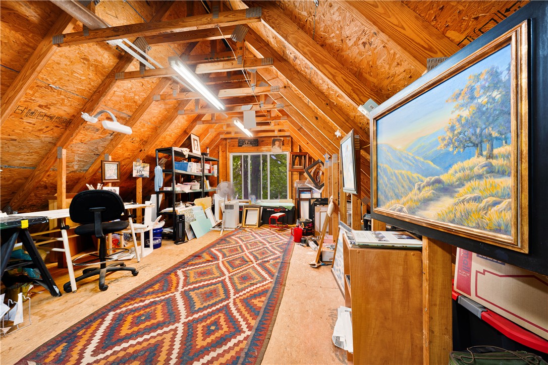 139 Tulip Lane Westminster, SC 29693 - Photo 28 of 37 An airy, wood-beamed attic offers versatile space, perfect for an art studio or creative pursuits.