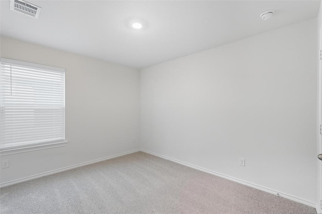 110 Labein Avenue Greenville, TX 75402 - Photo 11 of 20 an empty room with a window