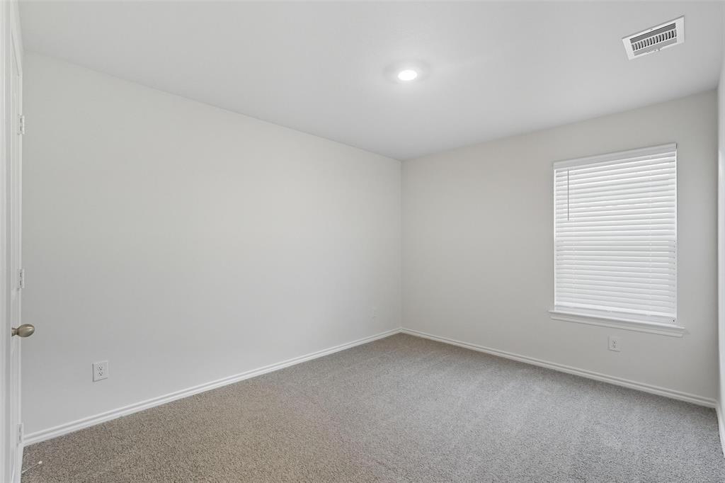 110 Labein Avenue Greenville, TX 75402 - Photo 13 of 20 an empty room with a window