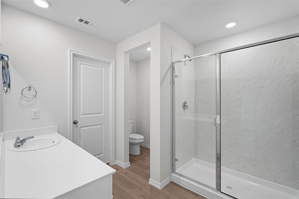 110 Labein Avenue Greenville, TX 75402 - Photo 15 of 20 a bathroom with a sink a toilet and shower