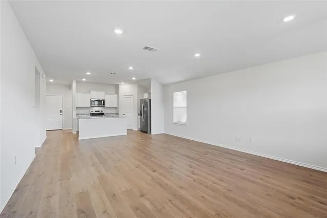 a view of kitchen with wooden floor