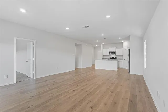 a view of kitchen with wooden floor