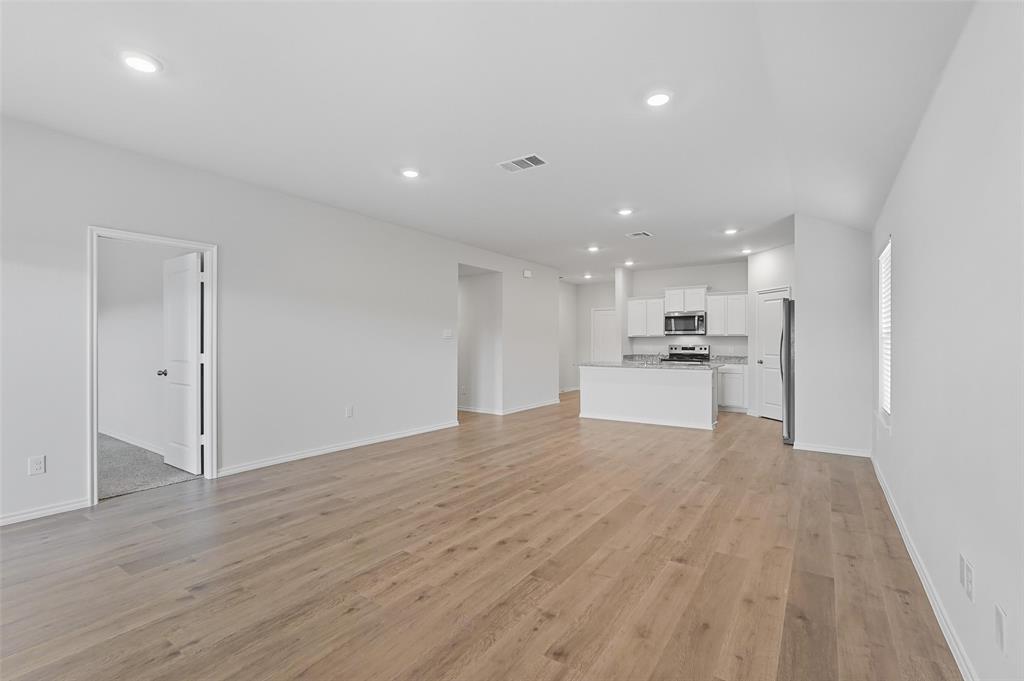 110 Labein Avenue Greenville, TX 75402 - Photo 3 of 20 a view of kitchen with wooden floor