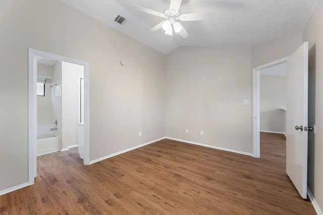 a kitchen with cabinets appliances a sink and a counter top space