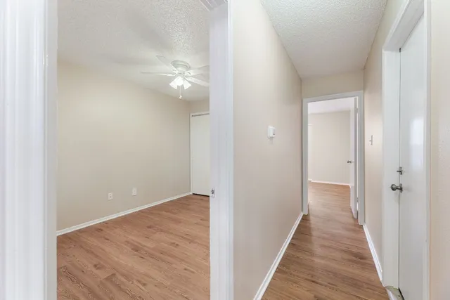 a white toilet sitting next to a bath tub