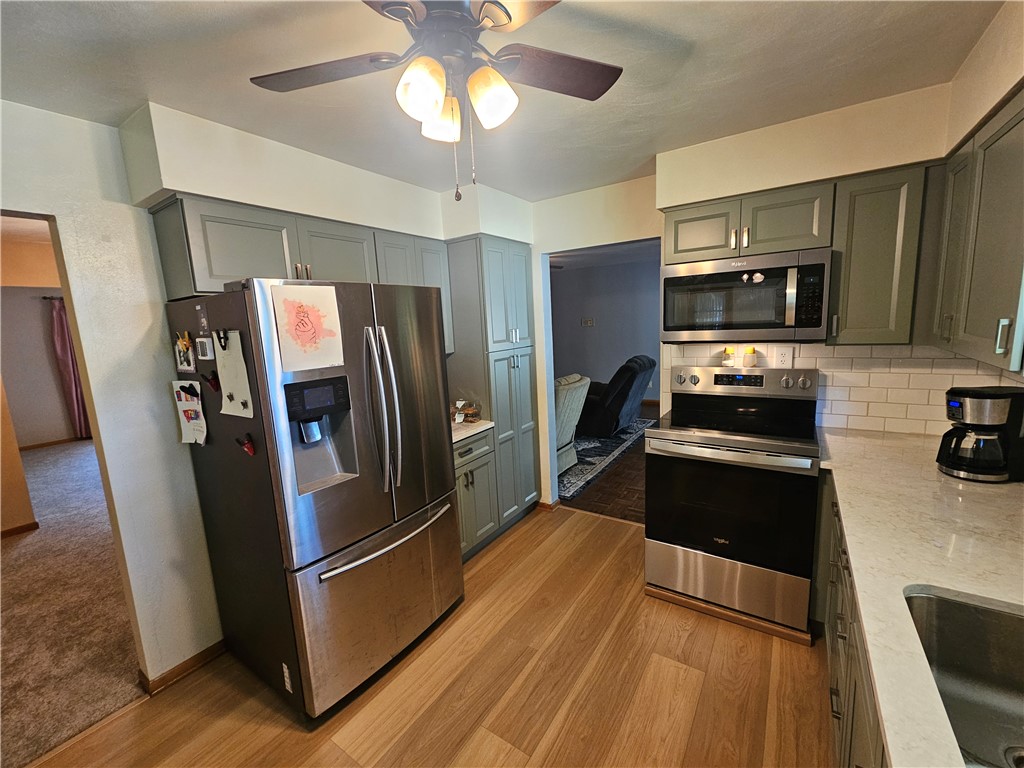 3998 Willowcrest Road Beavercreek, OH 45430 - Photo 12 of 41 This modern kitchen features sleek appliances and ample storage, creating a functional and inviting space.