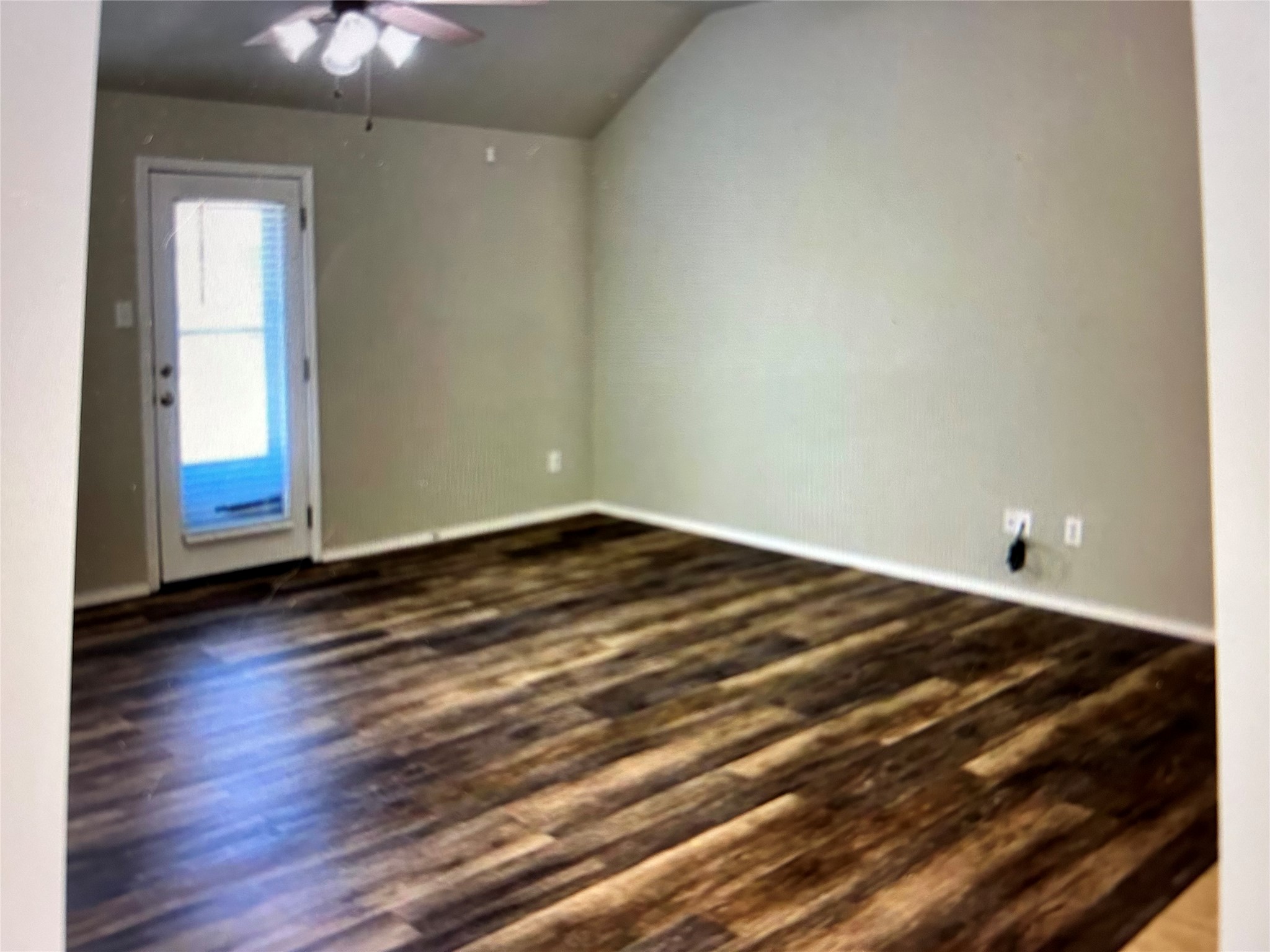 211 Animas Drive Georgetown, TX 78626 - Photo 9 of 25 a view of a room with wooden floor and fan