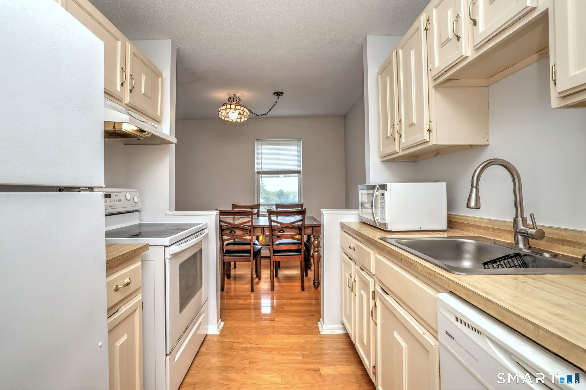 43 Balance Rock Road, Unit 11 Seymour, CT 06483 - Photo 11 of 40 a kitchen with a sink stove and cabinets