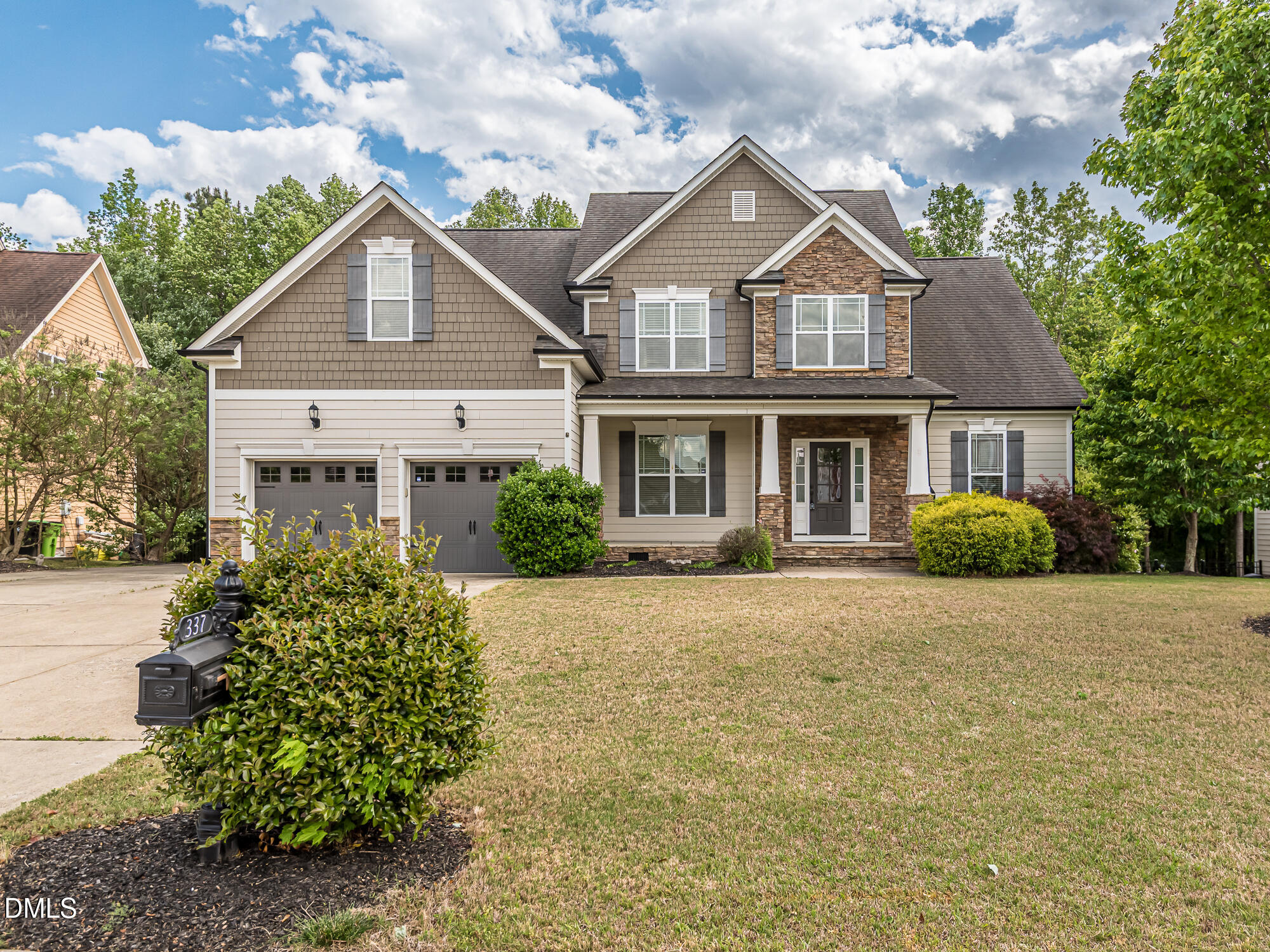 337 Shadowdale Lane Rolesville, NC 27571 - Photo 40 of 42 a front view of a house with a garden