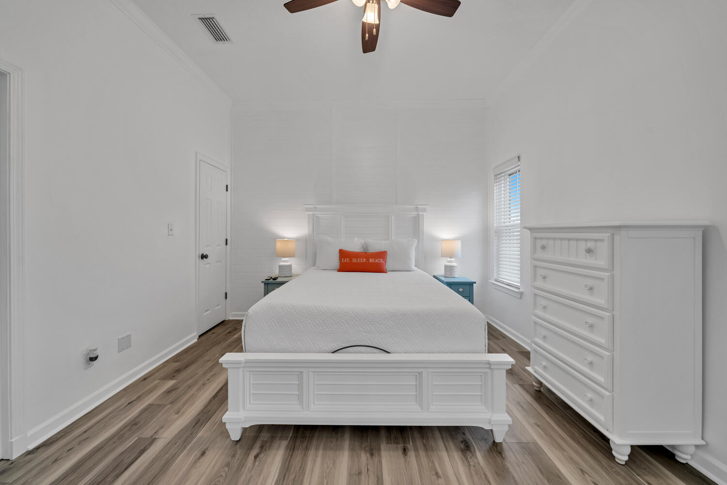 17878 Front Beach Road, Unit A1 Panama City Beach, FL 32413 - Photo 15 of 42 a bedroom with a bed and wooden floor