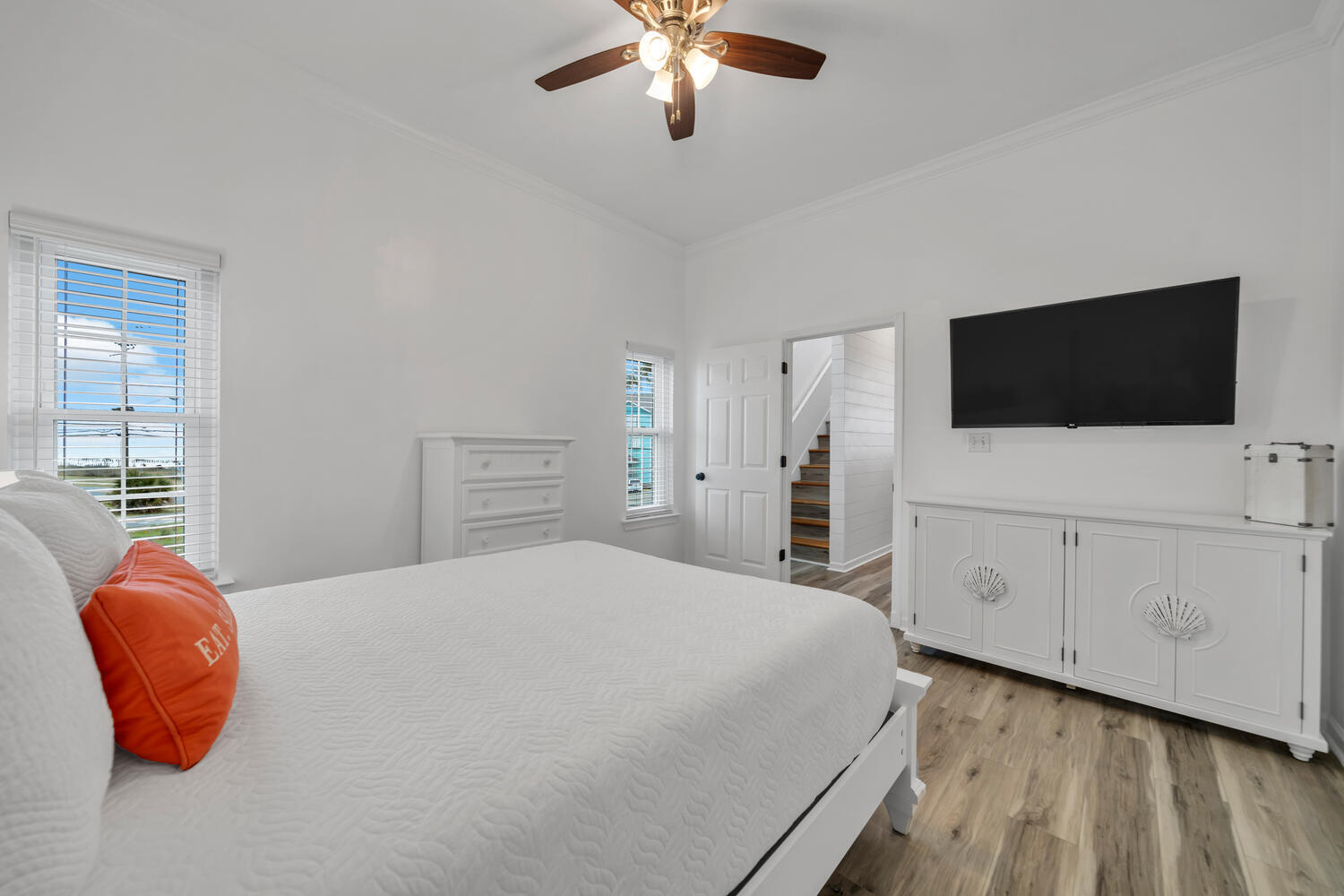 17878 Front Beach Road, Unit A1 Panama City Beach, FL 32413 - Photo 16 of 42 a bedroom with a bed and flat screen tv
