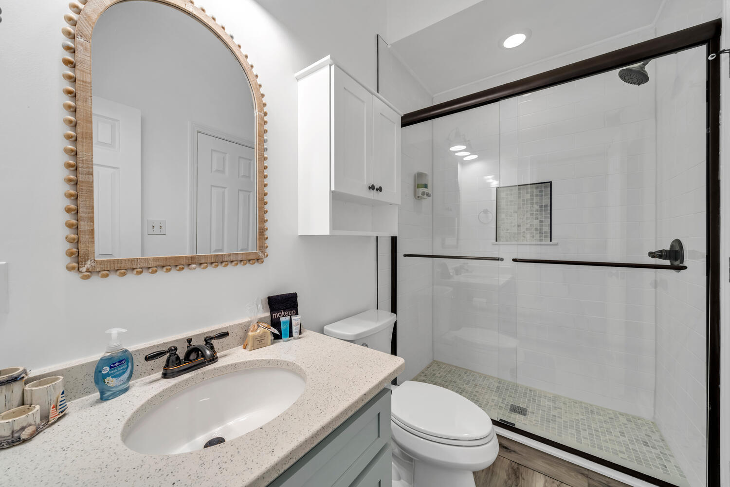 17878 Front Beach Road, Unit A1 Panama City Beach, FL 32413 - Photo 17 of 42 a bathroom with a sink toilet and shower