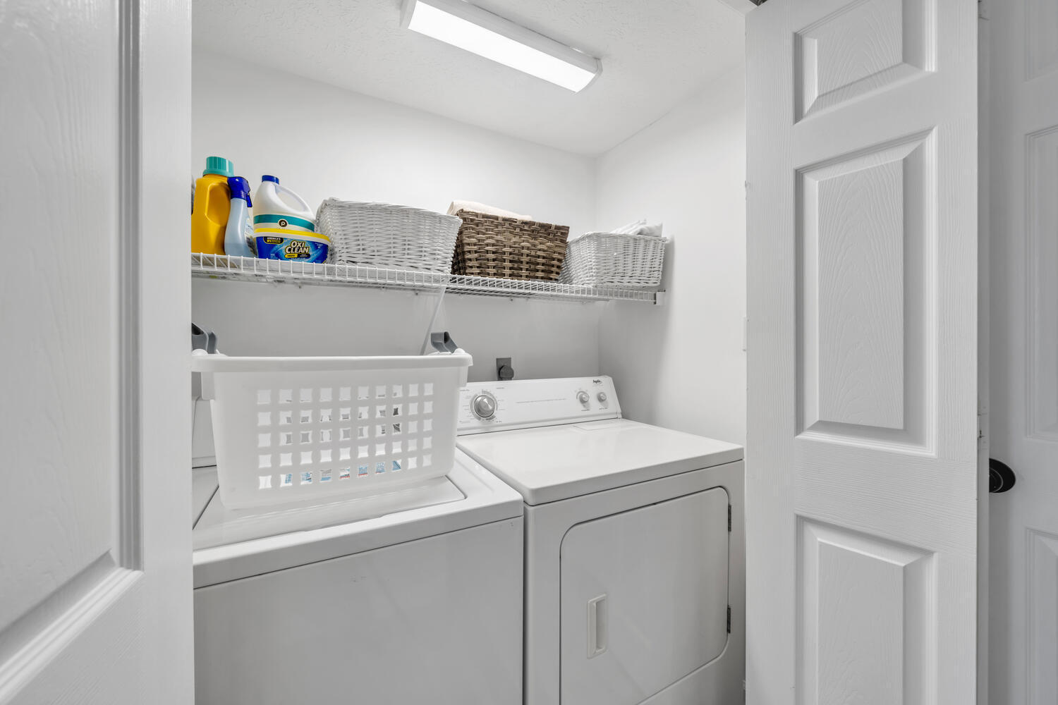 17878 Front Beach Road, Unit A1 Panama City Beach, FL 32413 - Photo 18 of 42 a utility room with dryer and washer