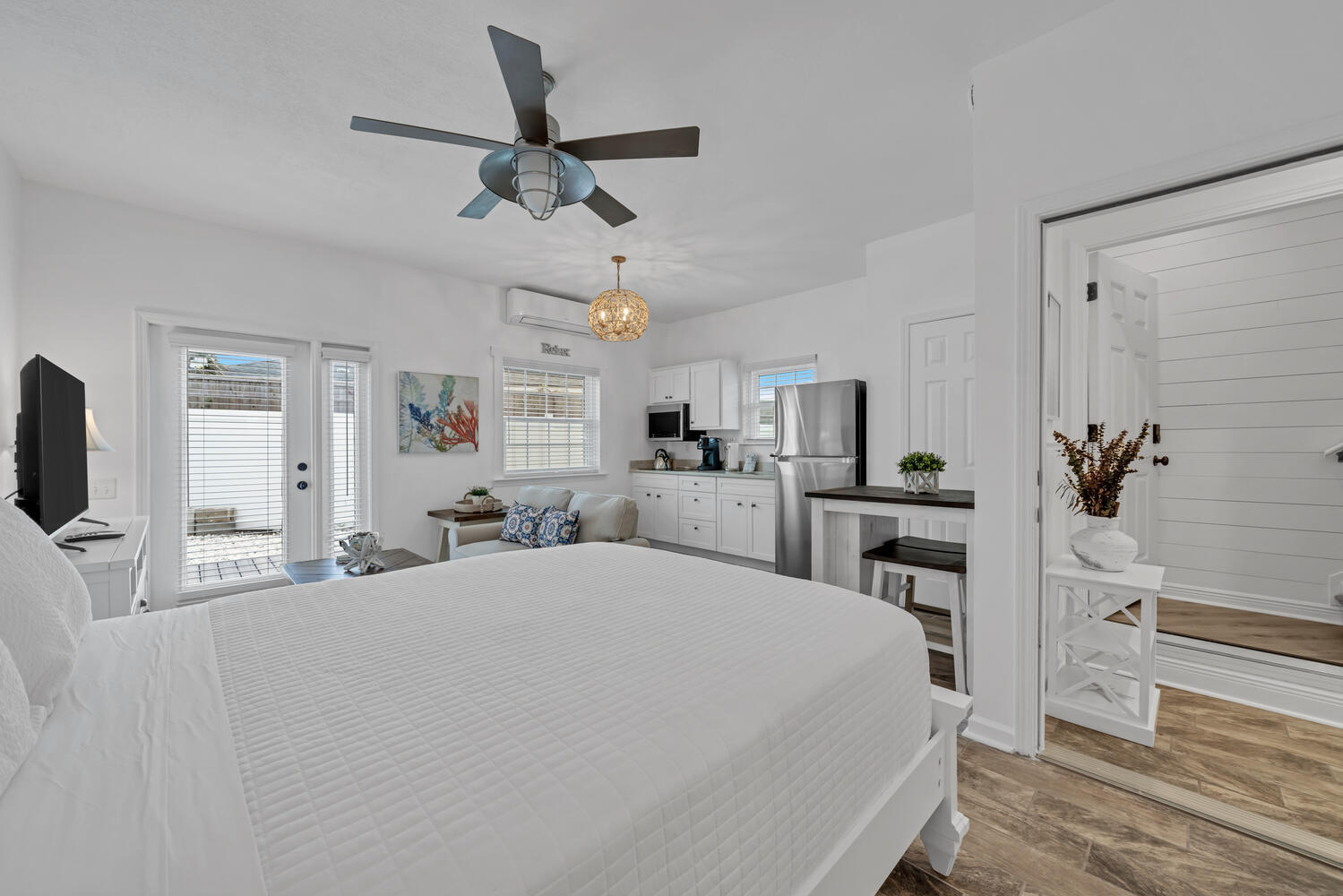 17878 Front Beach Road, Unit A1 Panama City Beach, FL 32413 - Photo 29 of 42 a bedroom with a bed and a flat screen tv