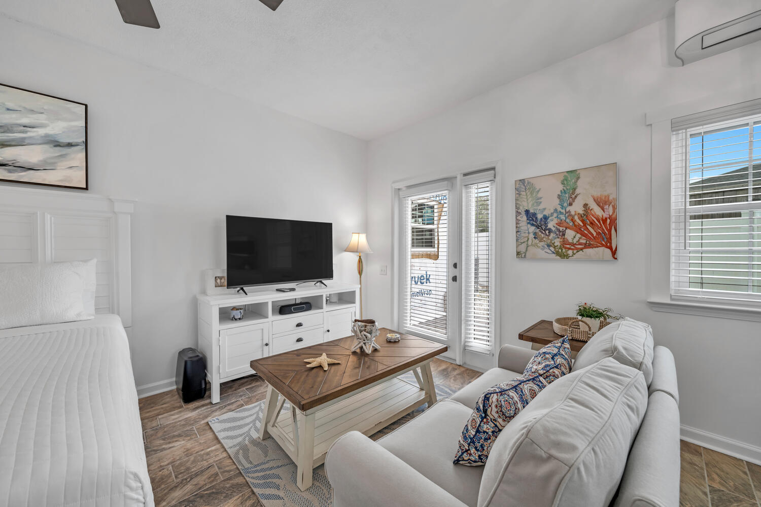 17878 Front Beach Road, Unit A1 Panama City Beach, FL 32413 - Photo 31 of 42 a living room with furniture and a flat screen tv